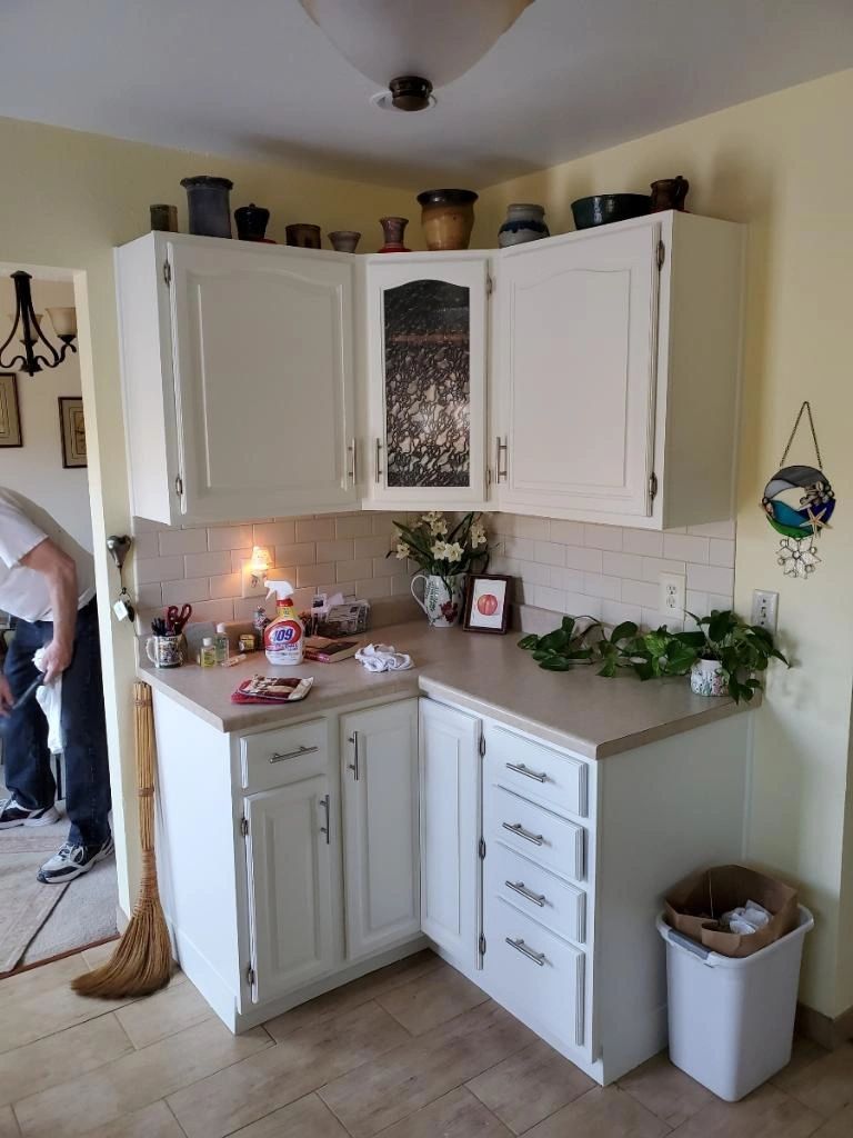 White painted kitchen cabinets after a refinish